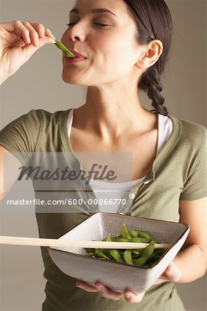Woman Eating Peas