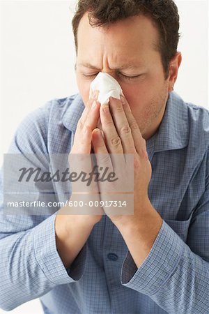 Man Blowing His Nose