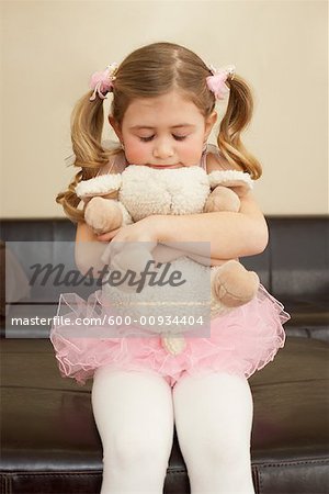 hugging stuffed animals