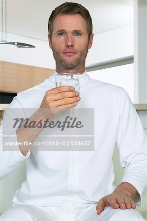 Portrait of Man Holding Beaker of Water