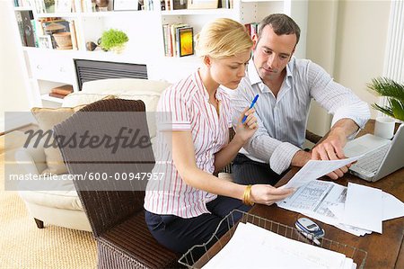 Couple Looking at Bills