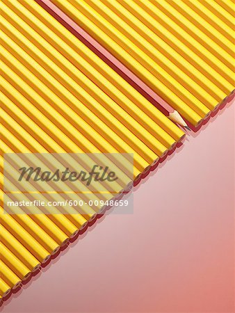 Row of Yellow Pencils With One Red Pencil