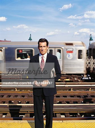 Businessman Waiting For Train