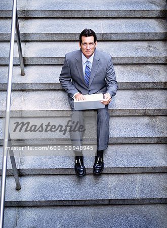 Portrait of Businessman Using Laptop Computer