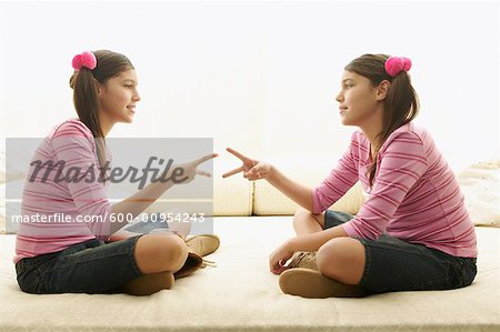 Twin Girls Playing Rock, Paper, Scissors