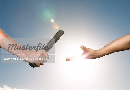 Hands Passing Baton