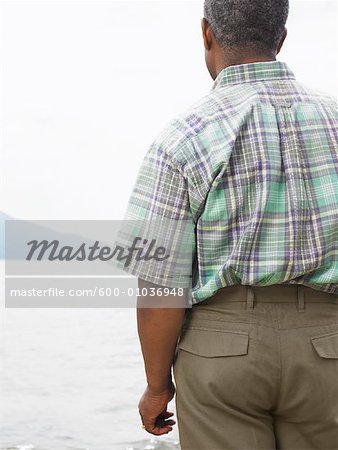 Man Standing on Shore