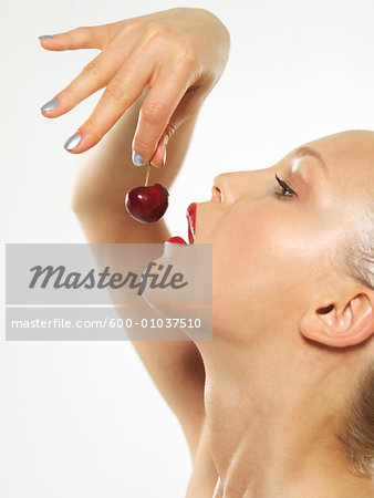 Woman Eating Cherry