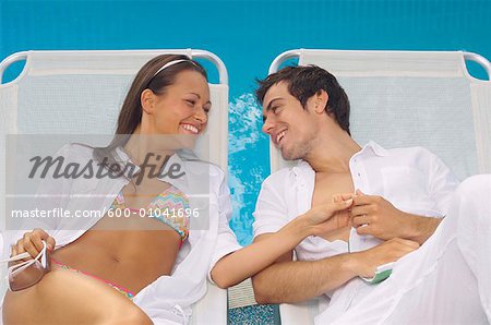 Couple Lounging Poolside
