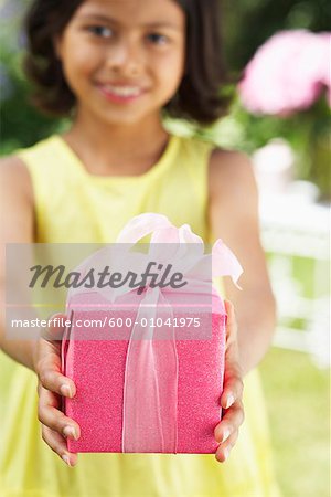 Girl Holding Wrapped Gift