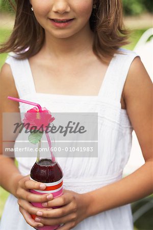 Close-up of Girl Holding Bottle of Soda Pop