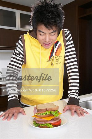 Boy Looking at Sandwich