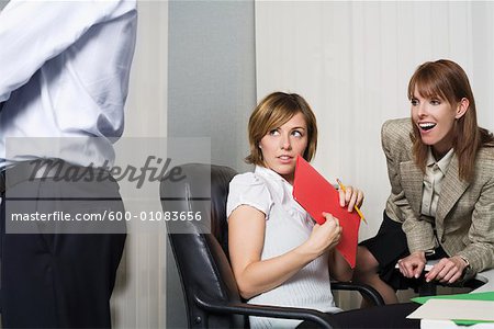 Business Women Looking at Coworker