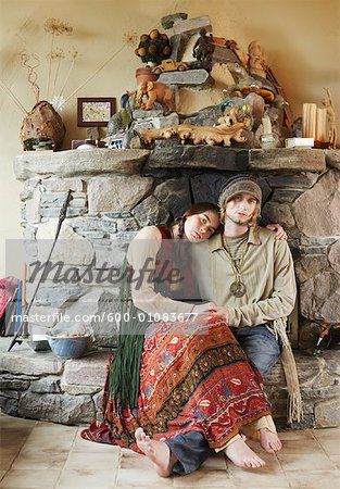 Hippie Couple in Front of Fireplace
