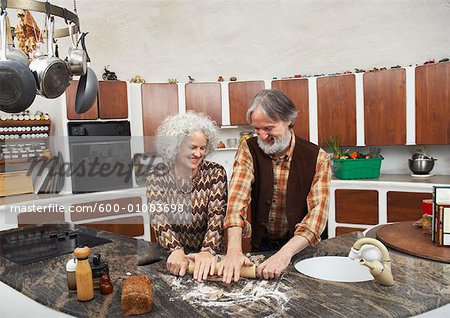 Couple Making Pastry in Kitchen