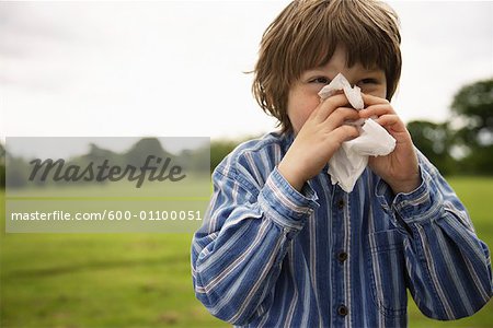 Boy Blowing Nose