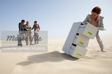 Business People and Filing Cabinet in Desert
