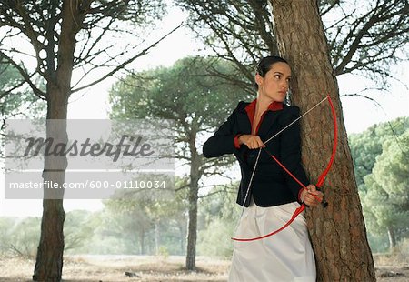 Businesswoman Using Bow and Arrow