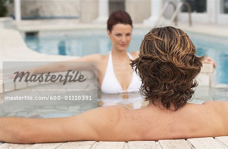 Man and Woman Sitting in Spa