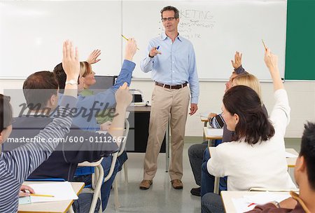 Students Raising Hands in Classroom