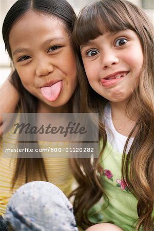 Girls Making Funny Faces Stock Photo Masterfile Premium Royalty Free Artist Masterfile Code 600 0112