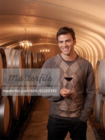 Man Standing in Wine Cellar