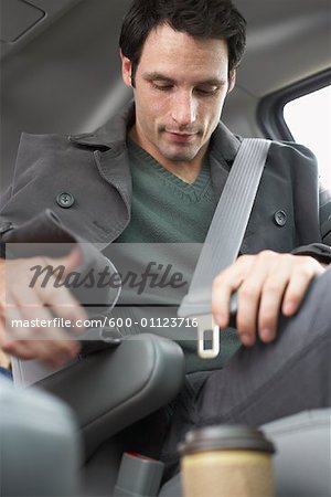 Man Buckling Seatbelt