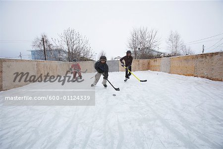 Kids Playing Ice Hockey