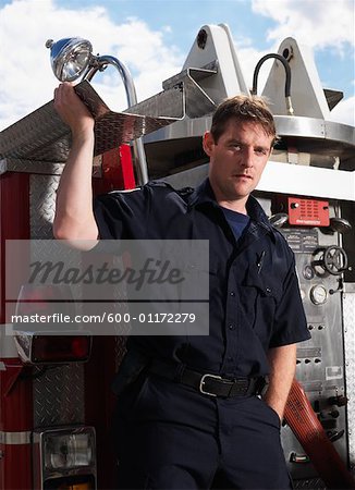 Firefighter on Back of Fire Truck