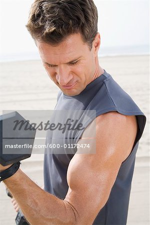 Man Exercising on Beach