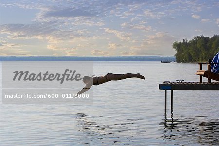 Woman Diving off of Dock