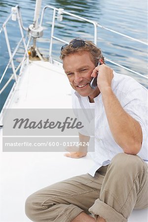 Man with Cellular Phone on Boat