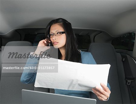 Businesswoman Working in Car