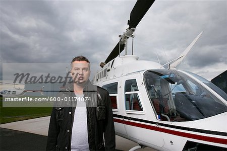 Portrait of Man Beside Helicopter