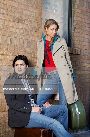 Portrait of Couple with Luggage