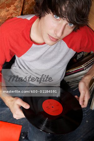 Young Man Holding Record