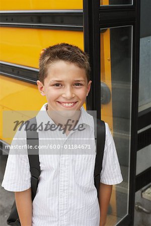 Boy by School Bus