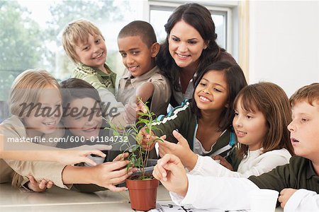 Students and Teacher with Plant in Classroom