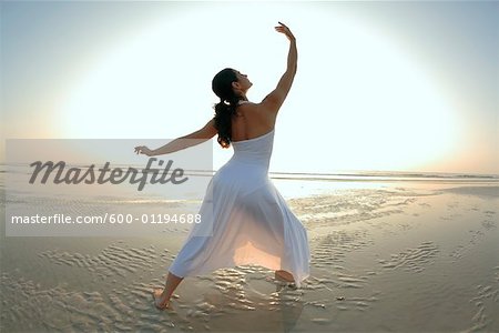 Woman Dancing at Beach
