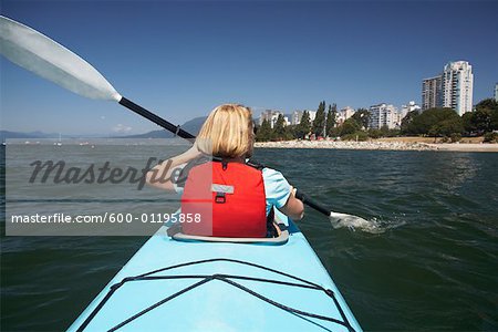 Woman Kayaking in False Creek, English Bay, Vancouver, British Columbia, Canada