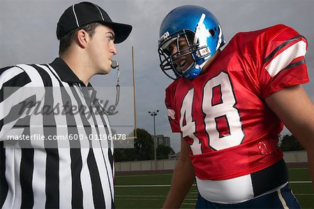 Football Player Yelling at Referee