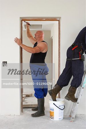 Men Painting House Interior
