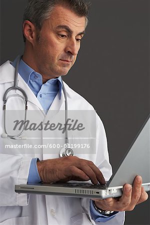Doctor using Laptop Computer
