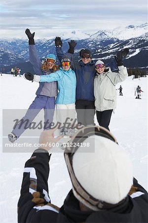 Person Taking Picture of Friends On Ski Hill, Whistler, BC, Canada