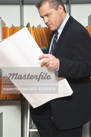 Businessman Looking at Records