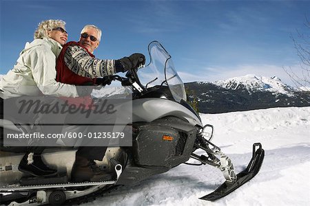 Couple Snowmobiling