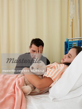 Man and Girl in Hospital Room
