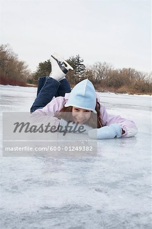 Girl Lying on Frozen Pond