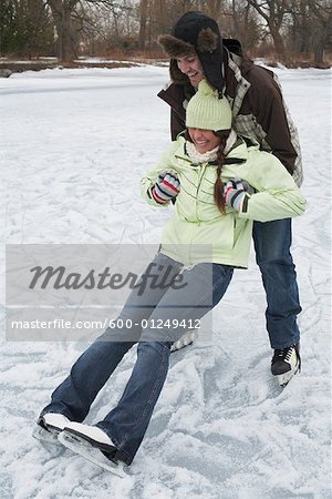 Man Catching Woman while Skating