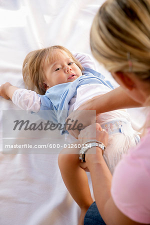 Little Girl Getting Diaper Changed Stock Photo Masterfile Premium Royalty Free Artist Norbert Schafer Code 600 01260134